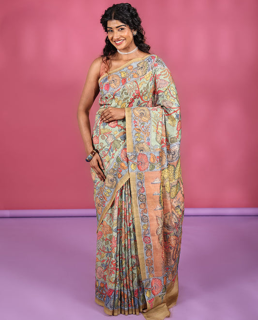 Light Pista Semi-Tussar Saree Colorfully Highlighted with Kalamkari-Style Floral Vine Print, Captivating Contrast Border Printed with Floral Motifs, Pallu Depicting Krishna and Gopis Print, and Paired with a Contrast Printed Blouse