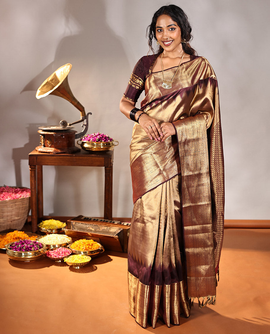 Scintillating Brown Vasundhara Lite-Silk Mix Saree, Gleamed Up with Zari on Its Body, Highlighted by Thazampoo Rekku Border of Neli, Paisa, Cross Kamalam, and Kodi Visiry Designs, a Grand Geometric-Patterned Pallu, and Paired with a Matching Blouse