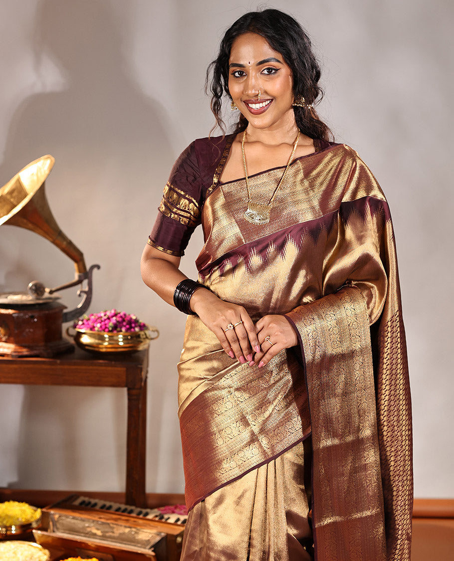 Scintillating Brown Vasundhara Lite-Silk Mix Saree, Gleamed Up with Zari on Its Body, Highlighted by Thazampoo Rekku Border of Neli, Paisa, Cross Kamalam, and Kodi Visiry Designs, a Grand Geometric-Patterned Pallu, and Paired with a Matching Blouse