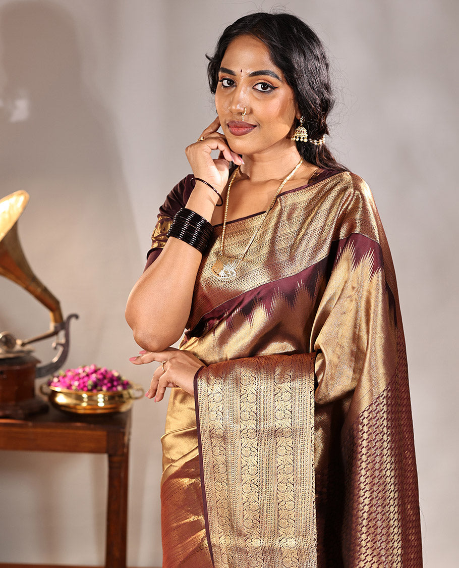 Scintillating Brown Vasundhara Lite-Silk Mix Saree, Gleamed Up with Zari on Its Body, Highlighted by Thazampoo Rekku Border of Neli, Paisa, Cross Kamalam, and Kodi Visiry Designs, a Grand Geometric-Patterned Pallu, and Paired with a Matching Blouse
