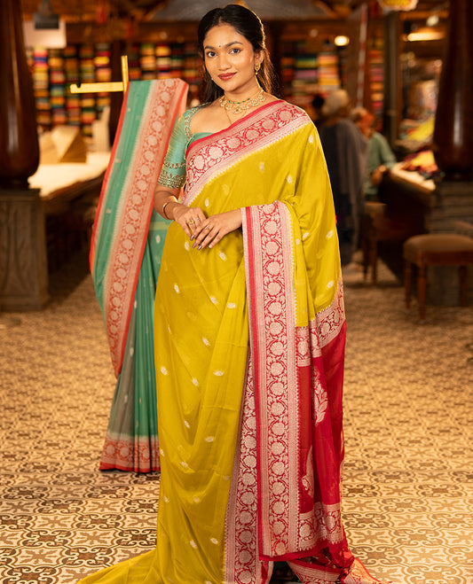 Mustard Banarasi Georgette Saree, Ornamented with Zari Buttas All Over Its Body, Complemented by a Contrast Floral Creeper Design Border, Pallu of Paisleys, and Paired with a Contrast Blouse