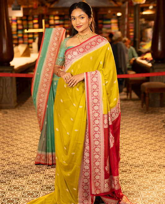 Mustard Banarasi Georgette Saree, Ornamented with Zari Buttas All Over Its Body, Complemented by a Contrast Floral Creeper Design Border, Pallu of Paisleys, and Paired with a Contrast Blouse