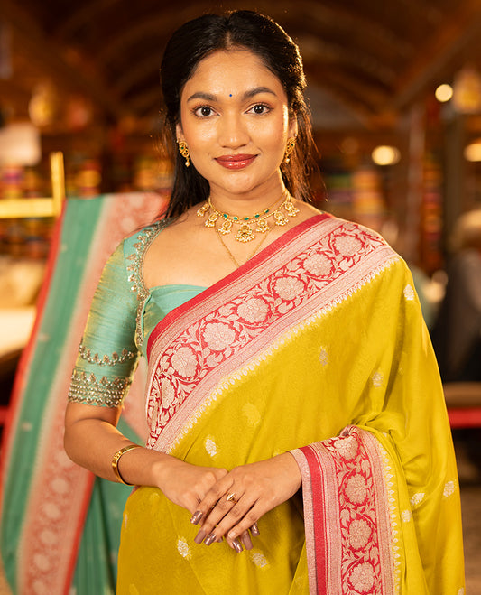 Mustard Banarasi Georgette Saree, Ornamented with Zari Buttas All Over Its Body, Complemented by a Contrast Floral Creeper Design Border, Pallu of Paisleys, and Paired with a Contrast Blouse