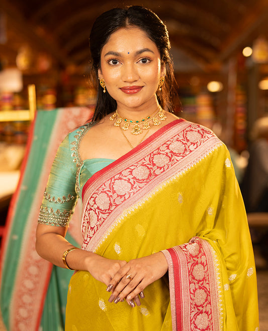 Mustard Banarasi Georgette Saree, Ornamented with Zari Buttas All Over Its Body, Complemented by a Contrast Floral Creeper Design Border, Pallu of Paisleys, and Paired with a Contrast Blouse