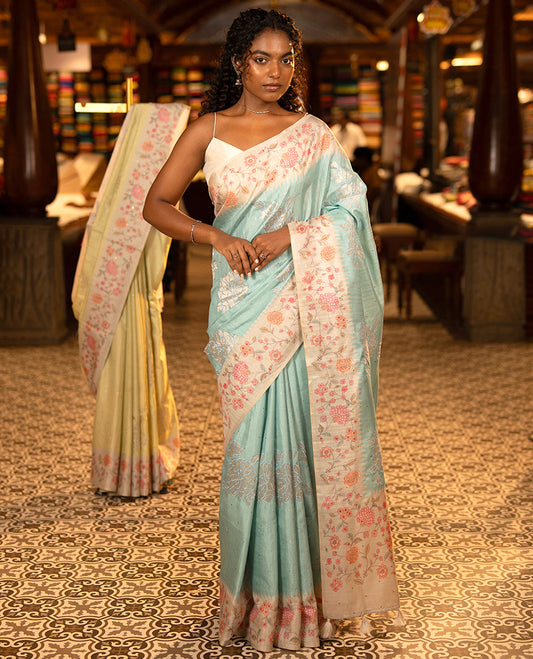 Sky Blue Fancy Tussar Silk Saree, Gleamed Up with Small Gold Buttas, and Applique Embroidery on Its Body, Complemented by a Contrast Temple Floral Creeper Printed Border, Pallu of Floral Creeper Print, and Paired with a Contrast Blouse