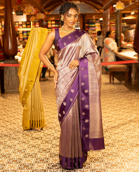 Purple Russian Dola Silk Saree, Meticulously Crafted with Zari Zig-Zag Jacquard on Its Body, Highlighted by Zari Buttas Woven Satin Border, Intricately Designed Pallu, and Paired with a Matching Blouse