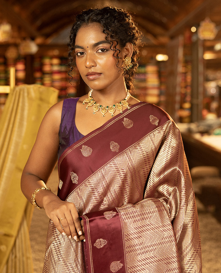 Magenta Pink Russian Dola Silk Saree, Gracefully Embellished with Zari Zig-Zag Jacquard on Its Body, Highlighted by Zari Buttas Woven Satin Border, Intricately Designed Pallu, and Paired with a Matching Blouse
