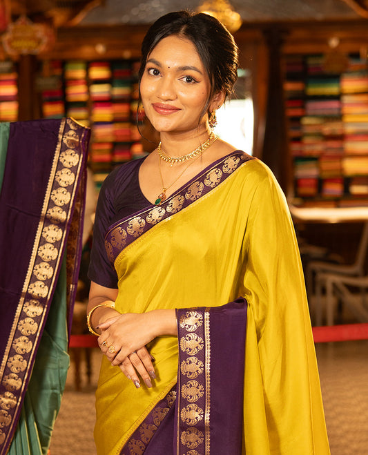 Mustard Plain Dola Silk Saree, Complemented by Contrast Rettai Pettu Ganda Berunda Motifs, Zari Border, Gleaming Zari Striped Pallu, and Paired with a Contrast Blouse