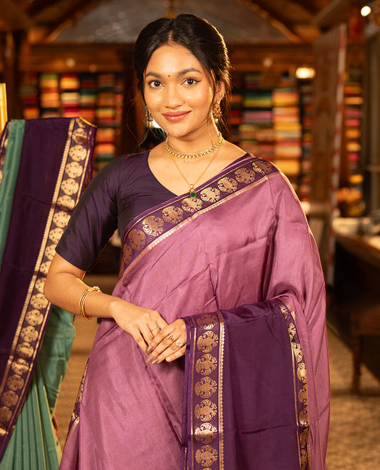 Onion Pink Plain Dola Silk Saree, Complemented by Contrast Rettai Pettu Ganda Berunda Motifs, Zari Border, Gleaming Zari Striped Pallu, and Paired with a Contrast Blouse