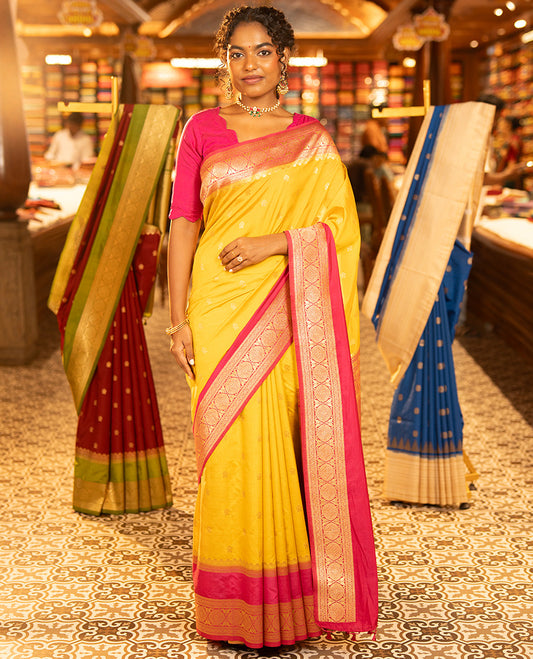 Mustard Yellow Dupion Silk Saree, Embellished with Buttas All Over Its Body, Complemented by Contrast Traditional Border of Paisleys and Chakram Designs, Intricately Designed Pallu, and Paired with a Contrast Blouse