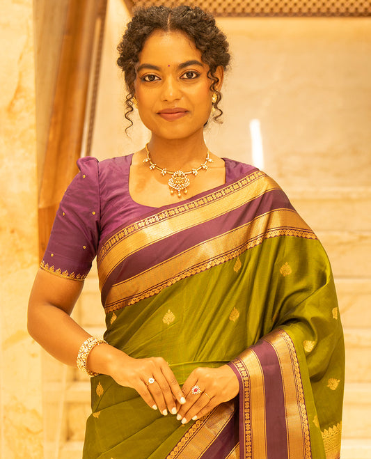 Mehendi Green-Magenta Vasundhara Lite Silk Mix Saree, Enriched with Zari Buttas, Complemented by Contrast Rettai Pettu Border of Salangai, Vanki, Mayil Kann, and Star Vanki Designs, Intricately Designed Pallu, and Paired with a Contrast Blouse