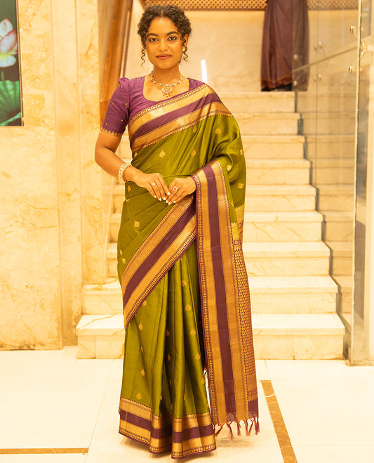 Mehendi Green-Magenta Vasundhara Lite Silk Mix Saree, Enriched with Zari Buttas, Complemented by Contrast Rettai Pettu Border of Salangai, Vanki, Mayil Kann, and Star Vanki Designs, Intricately Designed Pallu, and Paired with a Contrast Blouse
