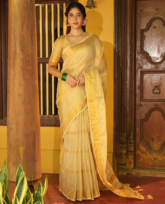 Gleaming Gold Khadi Tissue Saree, Elevated with Zari Stripes All Over Its Body, Highlighted by Zari Bavanji Border, Zari Striped Pallu, and Paired with a Matching Blouse