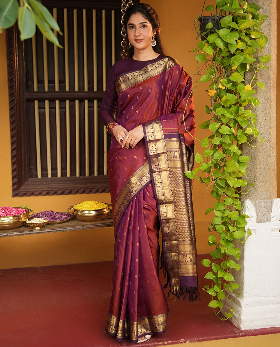 Red Vasundhara Silk Saree, Elevated with Zari Buttas All Over Its Body, Complemented by Contrast Border of Rekku, Manga and Mayil Designs, Grand Jaal Pallu, and Paired with a Contrast Blouse