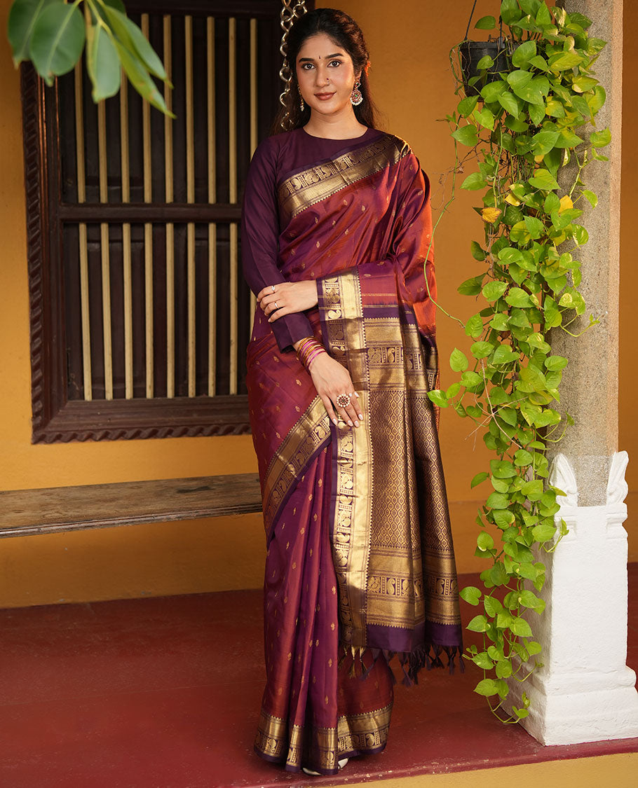 Red Vasundhara Silk Saree, Elevated with Zari Buttas All Over Its Body, Complemented by Contrast Border of Rekku, Manga and Mayil Designs, Grand Jaal Pallu, and Paired with a Contrast Blouse