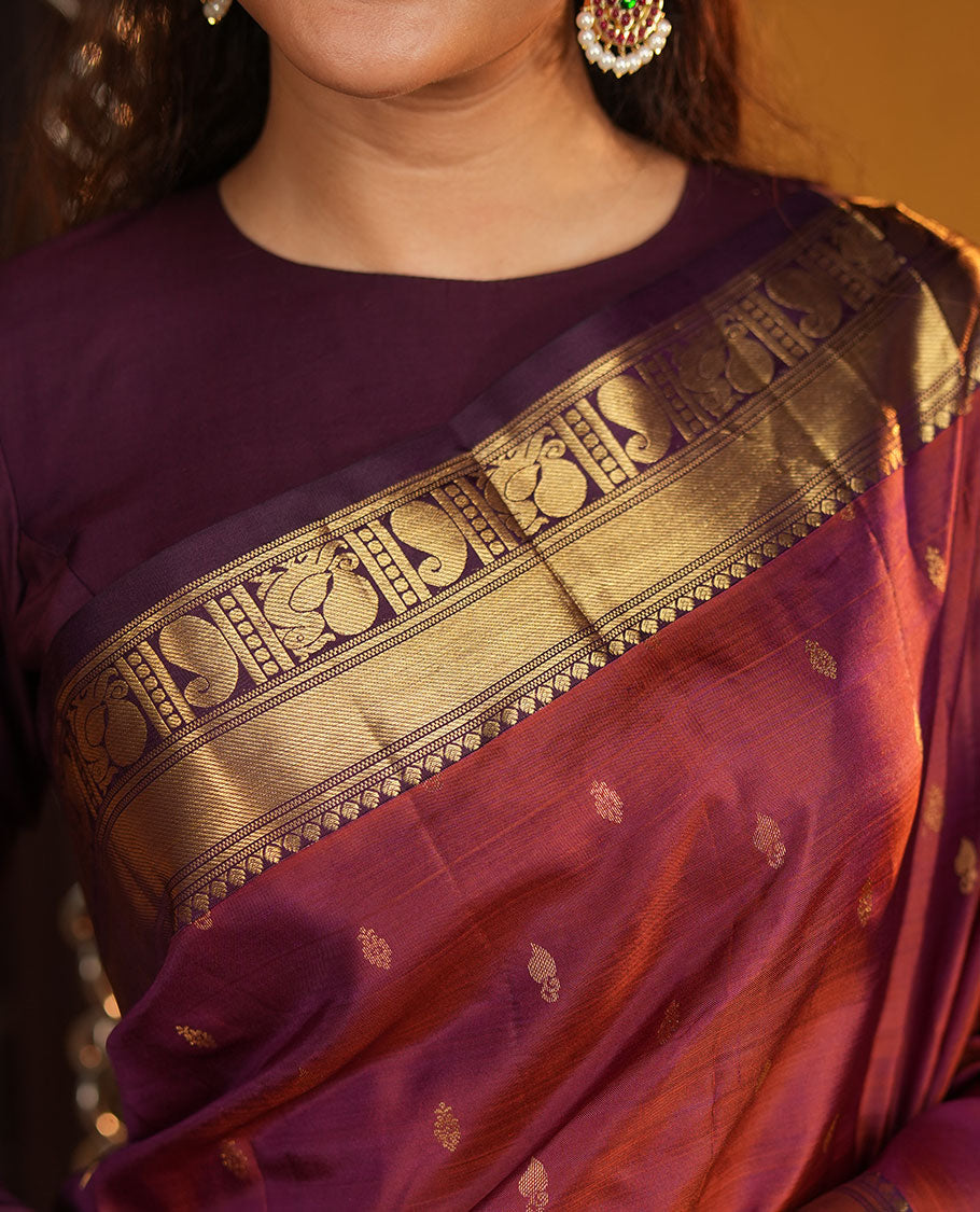Red Vasundhara Silk Saree, Elevated with Zari Buttas All Over Its Body, Complemented by Contrast Border of Rekku, Manga and Mayil Designs, Grand Jaal Pallu, and Paired with a Contrast Blouse