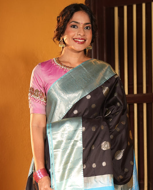 Black and Light Blue Budget Silk Saree, Ornamented with Zari Buttas on Its Body, Complemented by a Contrast Traditional Zari Design Border of Paisleys, Pallu Steeped with Paisley Designs, and Paired with a Contrast Blouse