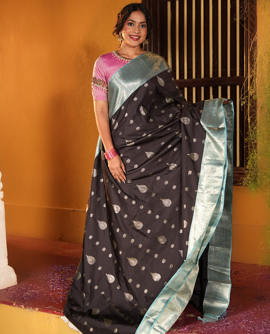 Black and Light Blue Budget Silk Saree, Ornamented with Zari Buttas on Its Body, Complemented by a Contrast Traditional Zari Design Border of Paisleys, Pallu Steeped with Paisley Designs, and Paired with a Contrast Blouse