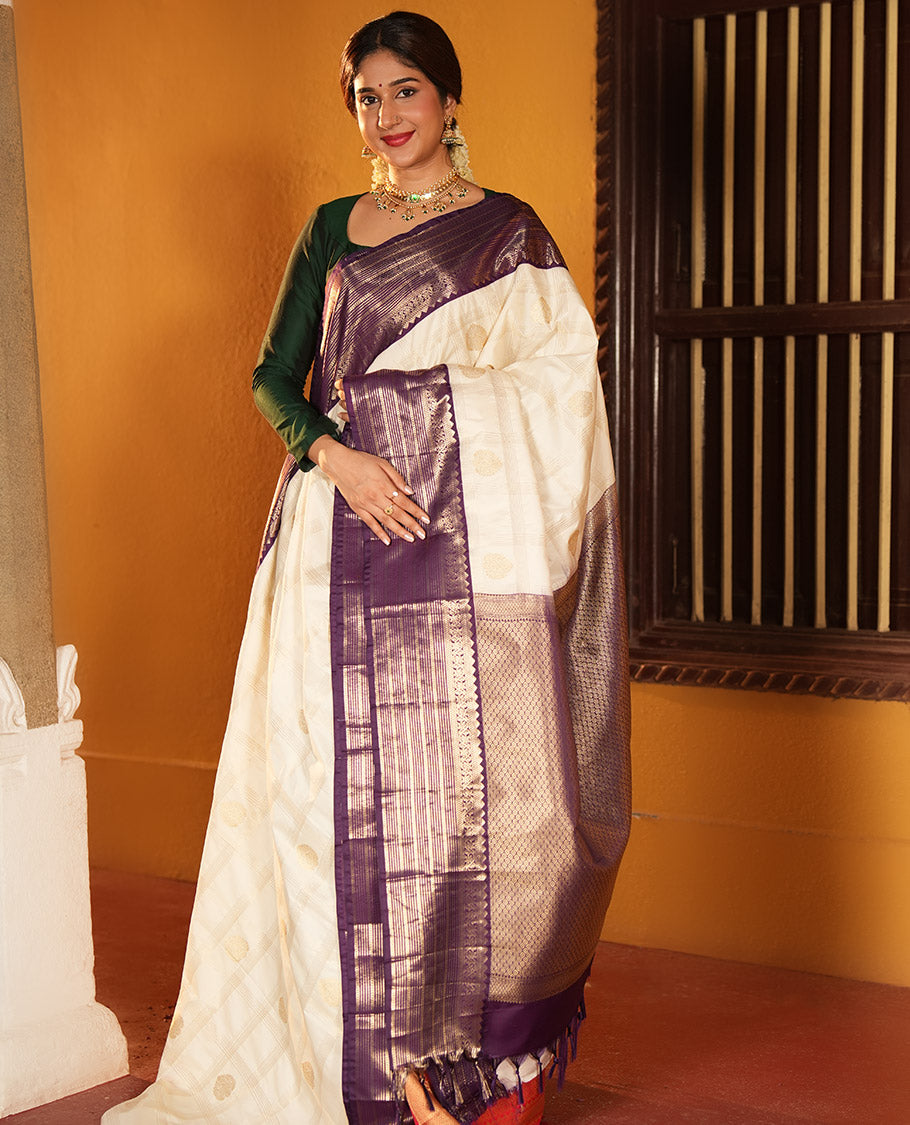 Off-White and Purple Budget Silk Saree, Bedecked with Zari Butta Enclosed Checks on Its Body, Complemented by a Contrast Traditional Zari Design Border of Paisleys, Grand Jaal Pallu, and Paired with a Contrast Blouse
