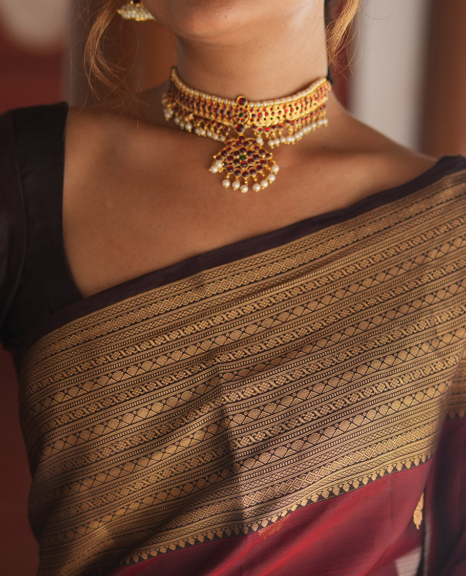 Wine and Maroon Vasundhara Lite Silk Mix Saree, Elevated with Zari Buttas All Over Its Body, Complemented by Contrast Border of Thilakam, Muthu, Banaras, Diamond, Mayil Kann, and Cross Kamalam Designs, Grand Pallu, and Paired with a Contrast Blouse
