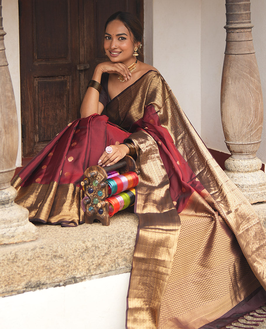 Wine and Maroon Vasundhara Lite Silk Mix Saree, Elevated with Zari Buttas All Over Its Body, Complemented by Contrast Border of Thilakam, Muthu, Banaras, Diamond, Mayil Kann, and Cross Kamalam Designs, Grand Pallu, and Paired with a Contrast Blouse