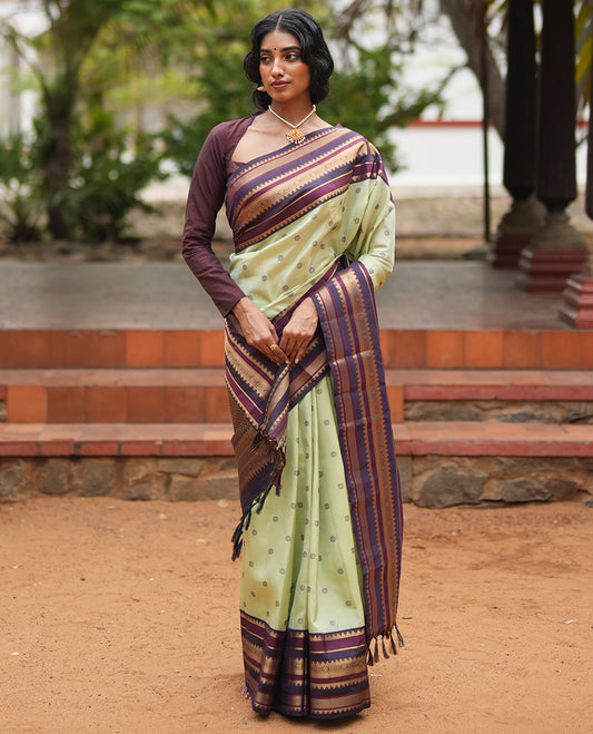 Pista Green and Coffee Brown Vasundenhara Lite Silk Mix Saree, Subtly Adorned with Buttas All Over Its Body, Complemted by Contrast Border of Thazampoo Rekku, Banaras, Jada Nagam, and Ara Maadam Designs, Grand Pallu, and Paired with a Contrast Blouse