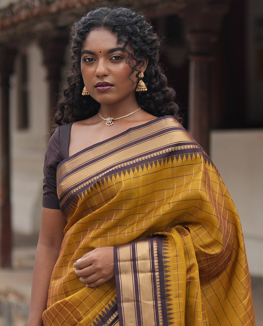 Mehendi Green and Brown Vasundhara Lite Silk Mix Saree, Graced with Checked Design All Over Its Body, Complemented by a Contrast Thazampoo Rekku Border of Manga Mokku, Muthu, and Mayil Kann Designs, Grand Pallu, and Paired with a Contrast Blouse
