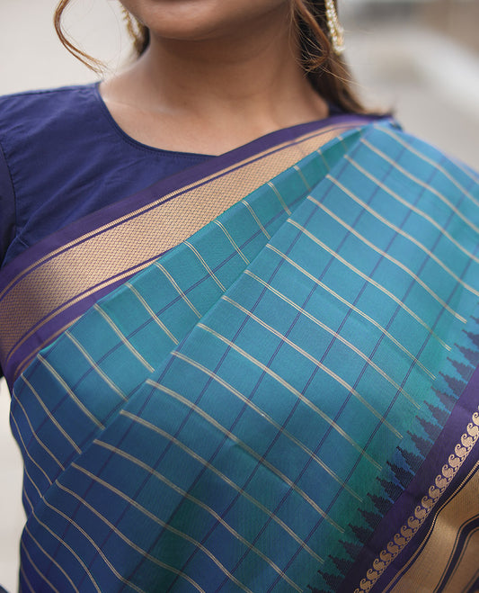 Mayil Color and Navy Blue Vasundhara Lite Silk Mix Saree, Graced with Checked Design All Over Its Body, Complemented by a Contrast Thazampoo Rekku Border of Manga Mokku, Muthu, and Mayil Kann Designs, Grand Pallu, and Paired with a Contrast Blouse