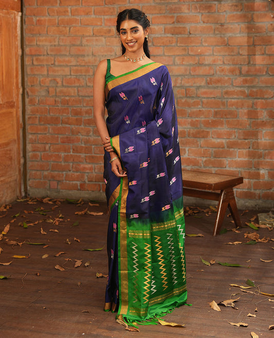 Blue Uppada Silk Saree Adorned with Meena Floral Buttas, Complemented by a Contrast Bavanji  Border, Pallu Steeped with Chevron Stripes, and Paired with a Contrast Blouse