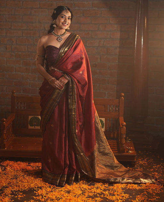 Crimson Red Vasundhara Silk Saree Featuring Vaira Oosi, and Annam Chakram Buttas, Complemented by a Contrast Border of Thilakam, Banaras, Mayil, Mayil Kann, Ara Bogudi, Muthu, and Banaras Designs, Grandly Woven Pallu, and a Contrast Blouse