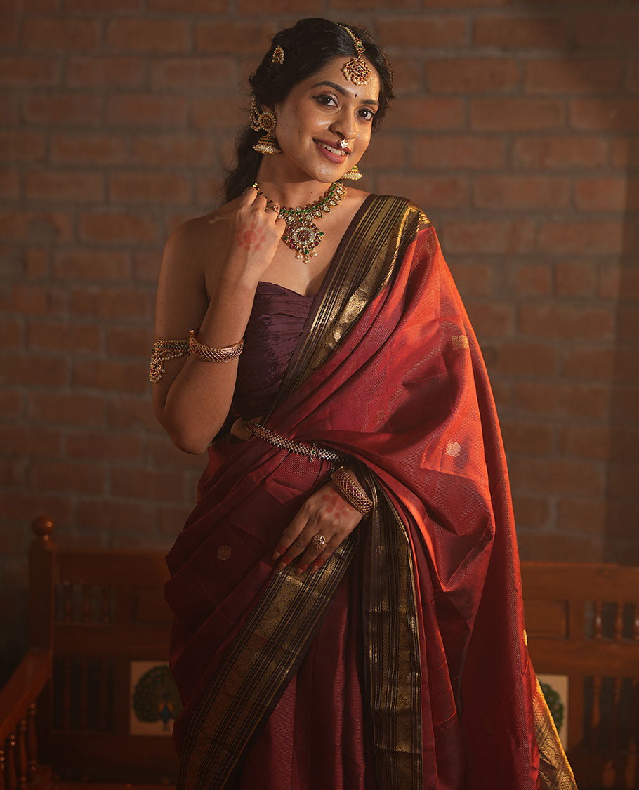 Crimson Red Vasundhara Silk Saree Featuring Vaira Oosi, and Annam Chakram Buttas, Complemented by a Contrast Border of Thilakam, Banaras, Mayil, Mayil Kann, Ara Bogudi, Muthu, and Banaras Designs, Grandly Woven Pallu, and a Contrast Blouse