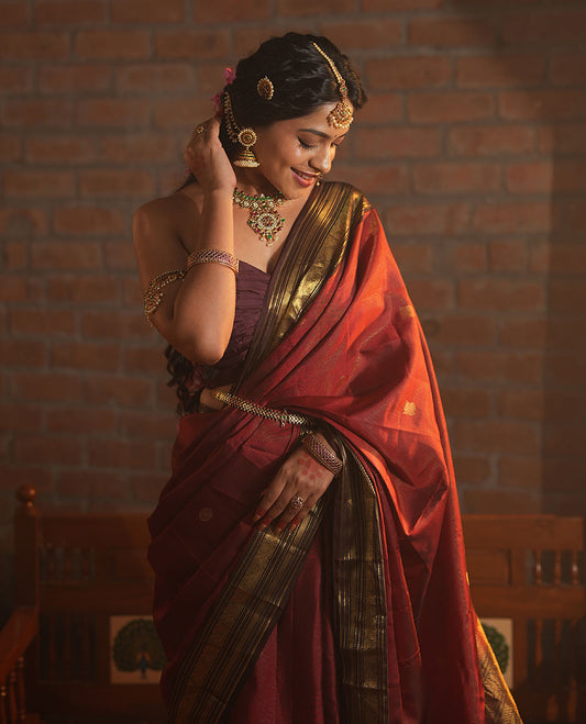 Crimson Red Vasundhara Silk Saree Featuring Vaira Oosi, and Annam Chakram Buttas, Complemented by a Contrast Border of Thilakam, Banaras, Mayil, Mayil Kann, Ara Bogudi, Muthu, and Banaras Designs, Grandly Woven Pallu, and a Contrast Blouse