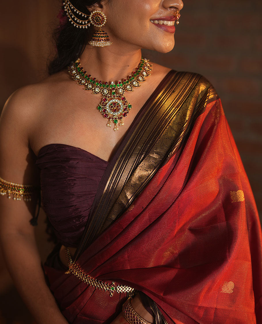 Crimson Red Vasundhara Silk Saree Featuring Vaira Oosi, and Annam Chakram Buttas, Complemented by a Contrast Border of Thilakam, Banaras, Mayil, Mayil Kann, Ara Bogudi, Muthu, and Banaras Designs, Grandly Woven Pallu, and a Contrast Blouse
