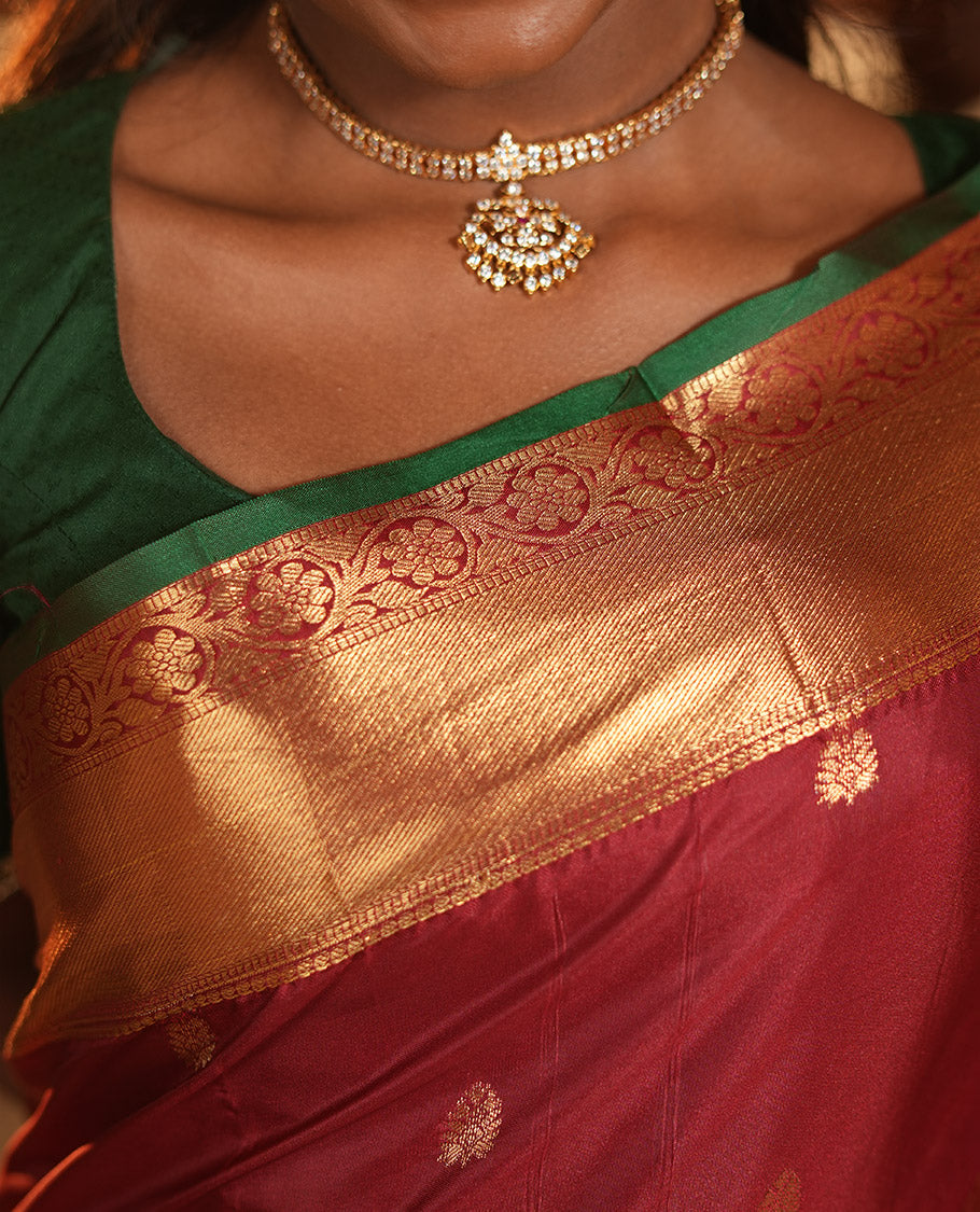 Maroon Budget Silk Saree, Dazzled with Zari Buttas, Highlighted by a Traditional Zari Border, Grand Ogee Pallu, and a Matching Blouse