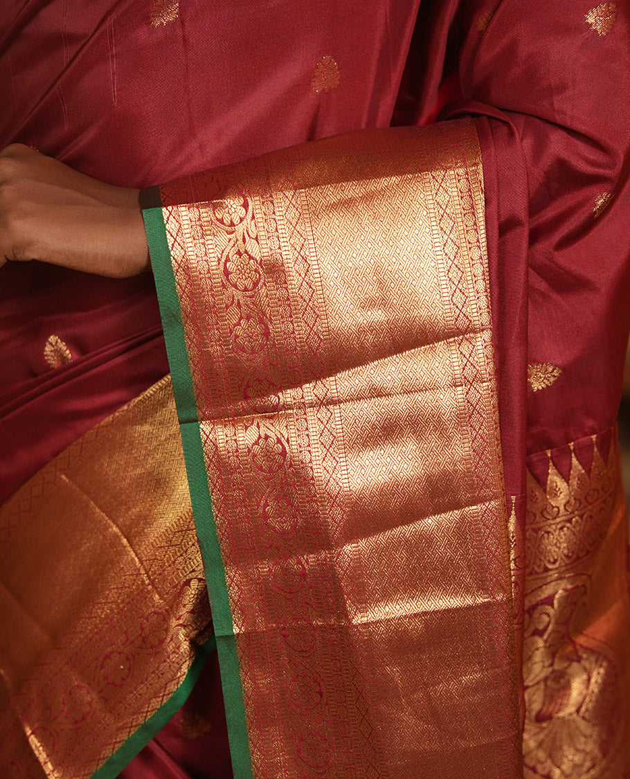 Maroon Budget Silk Saree, Dazzled with Zari Buttas, Highlighted by a Traditional Zari Border, Grand Ogee Pallu, and a Matching Blouse