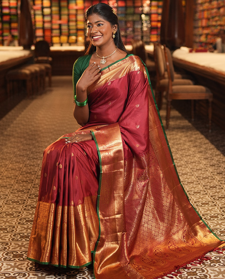 Maroon Budget Silk Saree, Dazzled with Zari Buttas, Highlighted by a Traditional Zari Border, Grand Ogee Pallu, and a Matching Blouse