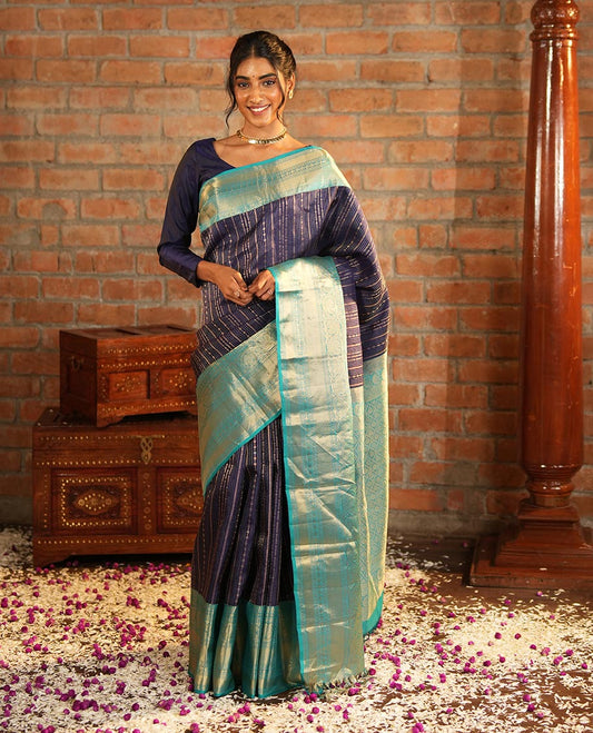 Blue Vasundhara Silk Saree Adorned with Jacquard Design Weave All Over Its Body, Complemented by a Contrast Border of Rekku, Muthu, Laddu Kamalam, Then Kuli Kann, and Dhavana Kodi Designs, Artfully Zari Woven Pallu, and Paired with a Contrast Blouse