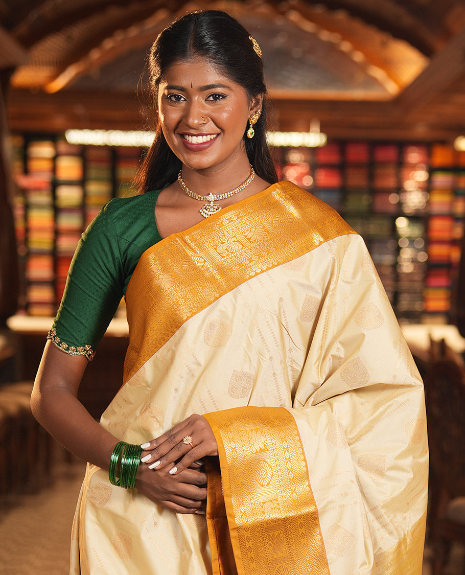 Biscuit-Yellow Budget Silk Saree, Woven with Zari Buttas, Complemented by a Contrast Traditional Zari Border, Grand Jaal Pallu, and a Contrast Blouse
