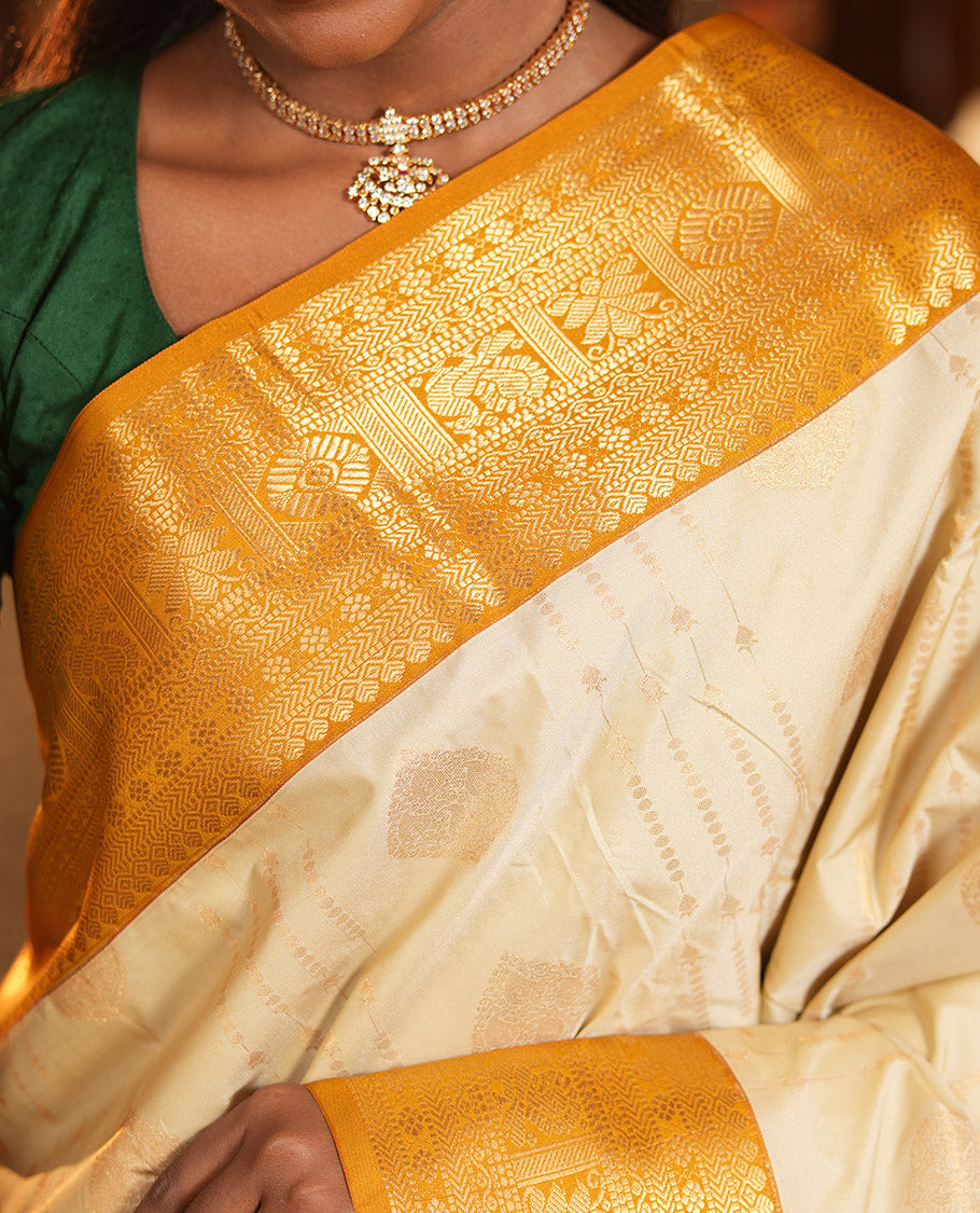 Biscuit-Yellow Budget Silk Saree, Woven with Zari Buttas, Complemented by a Contrast Traditional Zari Border, Grand Jaal Pallu, and a Contrast Blouse