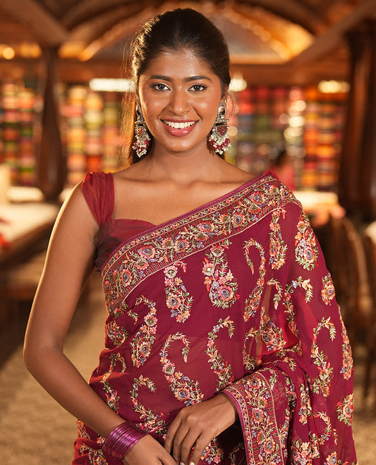 Wine Georgette Designer Saree Features Color-Thread Paisley Embroidery, a Matching Blouse