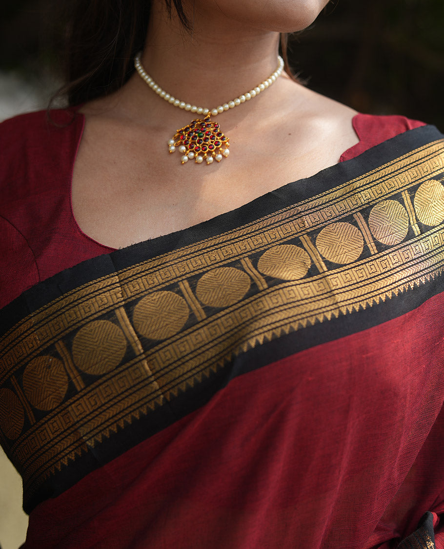 Maroon Plain Chettinad Cotton Saree, Complemented by a Contrast Rudraksham Design Traditional Zari  Border, Subtly Striped Pallu, and Paired with a Matching Blouse