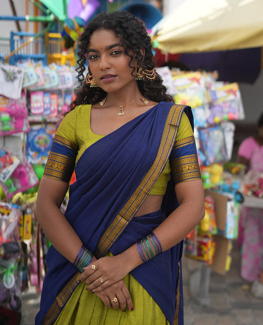 Liril Green-Royal Blue Mercerised Cotton Half-Saree Features Plain Skirt, Contrast Traditional Annam-Motif Border, a Matching Blouse, and Contrast Dhavani