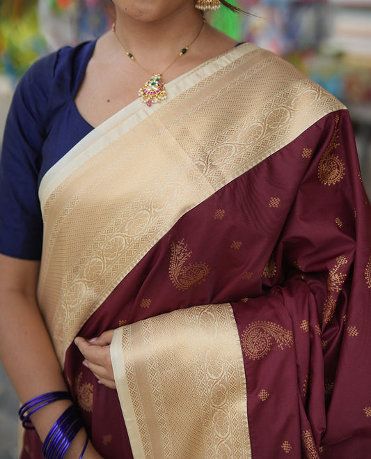 Maroon-Cream Budget Silk Saree, Adorned with Kolam and Floral Buttas, a Contrast Traditional Zari Border, Grand Pallu, and a Contrast Blouse