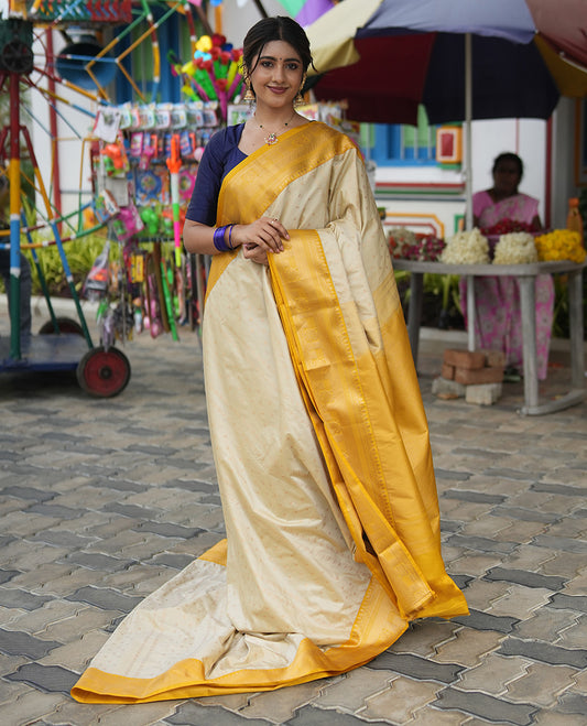 Biscuit-Yellow Budget Silk Saree, Subtly Sparkled with Zari Buttas, a Contrast Traditional Zari Border, Grand Pallu, and a Contrast Blouse