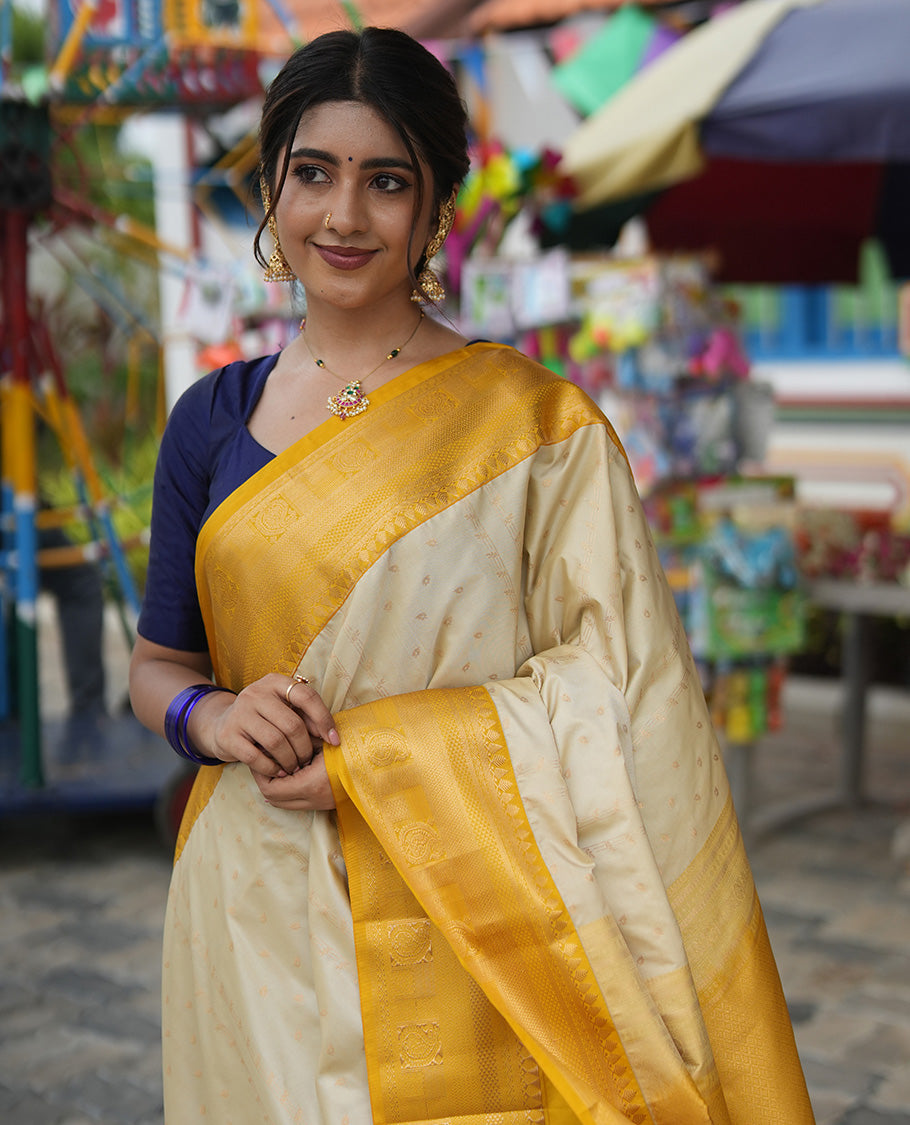Biscuit-Yellow Budget Silk Saree, Subtly Sparkled with Zari Buttas, a Contrast Traditional Zari Border, Grand Pallu, and a Contrast Blouse