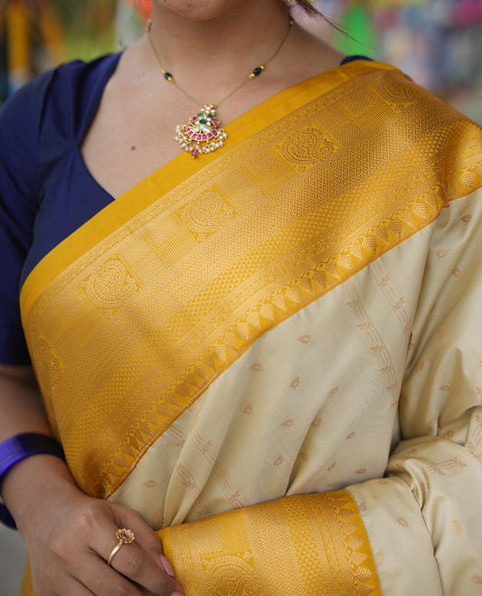 Biscuit-Yellow Budget Silk Saree, Subtly Sparkled with Zari Buttas, a Contrast Traditional Zari Border, Grand Pallu, and a Contrast Blouse