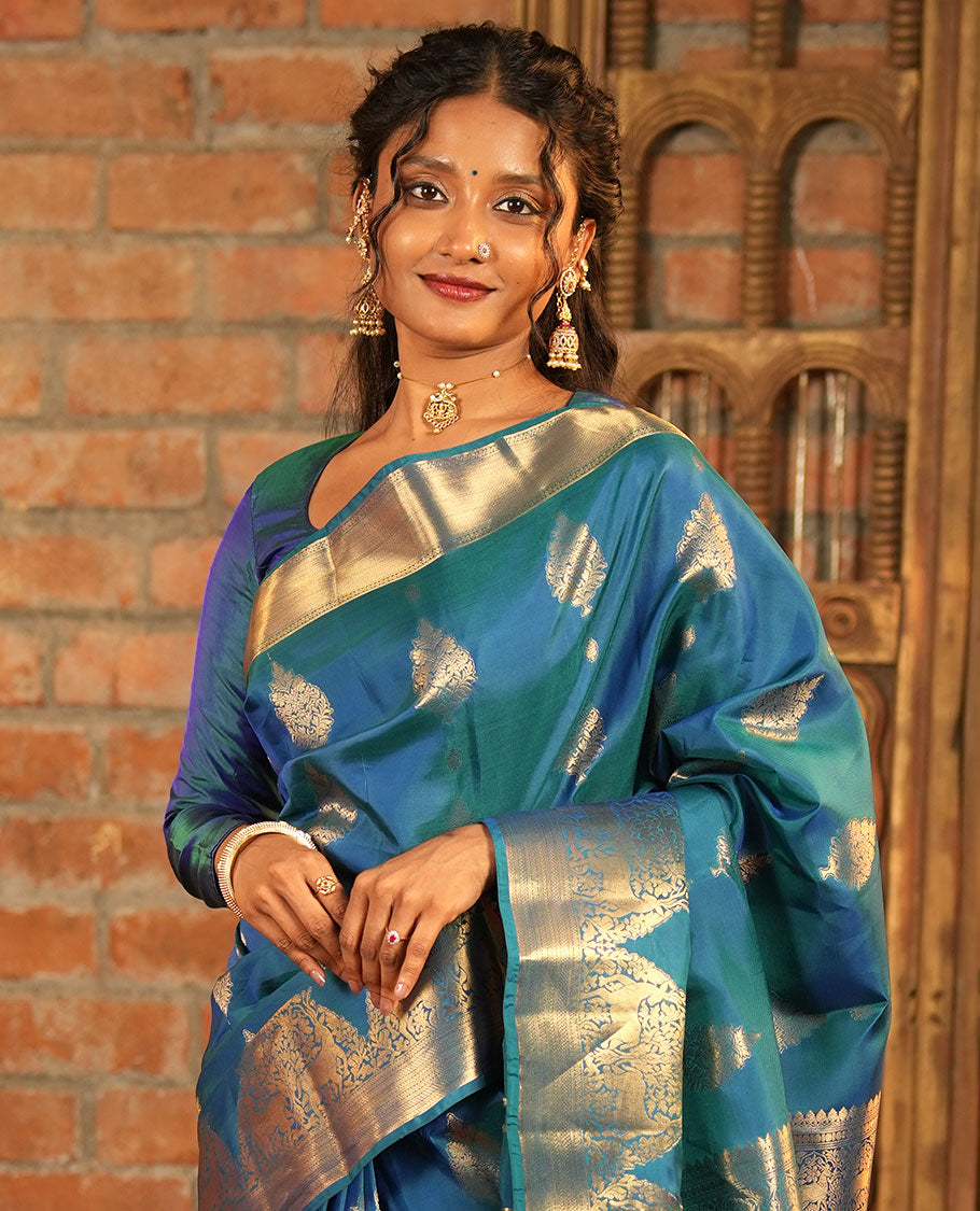 Blue Vasundhara Lite-Silk Mix Saree, Embellished with Zari Buttas All Over Its Body, Highlighted by Zari Border of Neli, Kuyil Kann, Kathir, and Maan Designs, Gracefully Embellished Pallu of Jaal Design, and Paired with a Matching Blouse
