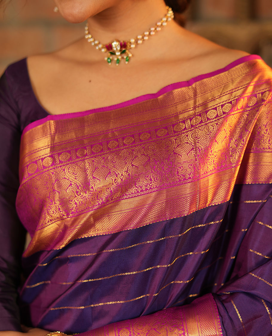 Purple Vasundhara Silk Saree, Enriched with Neli Stripes On Its Body, Complemented by Captivating Contrast Border of Mayil Kann, Vanki, Iru Thalaipakshi, Chakram, and Neli Designs, Grand Pallu, and Paired with a Contrast Blouse