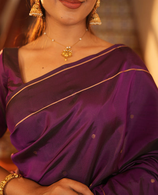 Purple Vasundhara Lite Silk Saree, Subtly Sparkled with Paisa Zari Buttas Across Its Body, Highlighted Zari Border of Horizontal Stripes, Gleaming Pallu of Seppu Rekku Designs, and Paired with a Matching Blouse