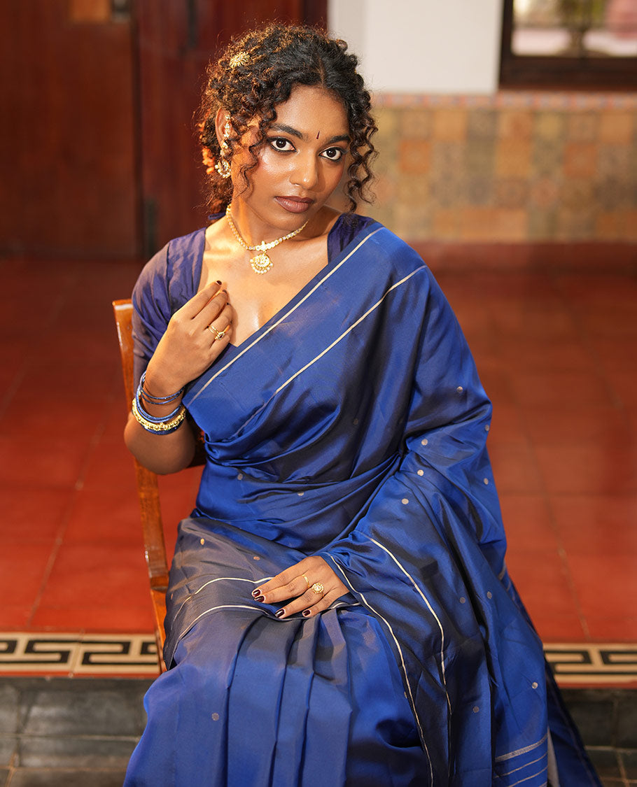 Navy Blue Vasundhara Lite Silk Saree, Subtly Sparkled with Paisa Zari Buttas Across Its Body, Highlighted Zari Border of Horizontal Stripes, Gleaming Pallu of Seppu Rekku Designs, and Paired with a Matching Blouse